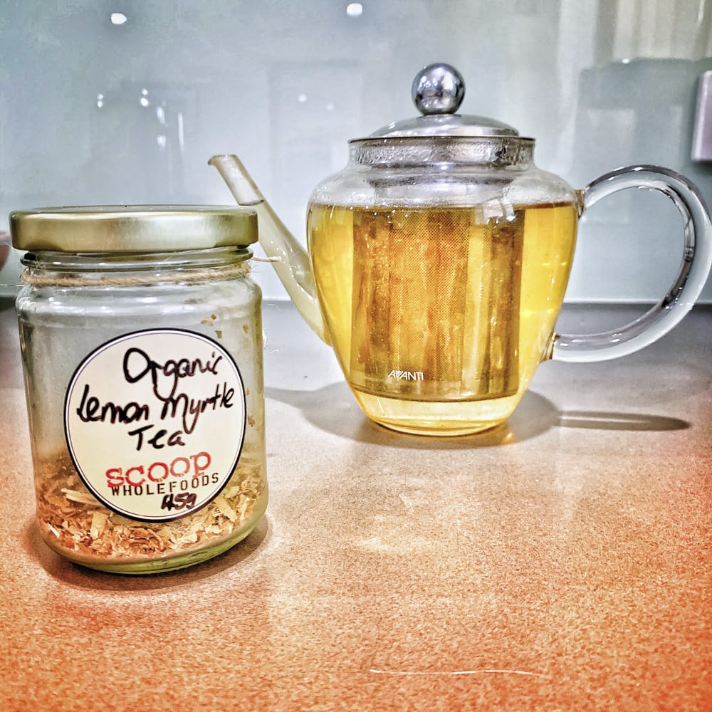 lemon myrte iced tea leaves in jar and pot of tea at back 