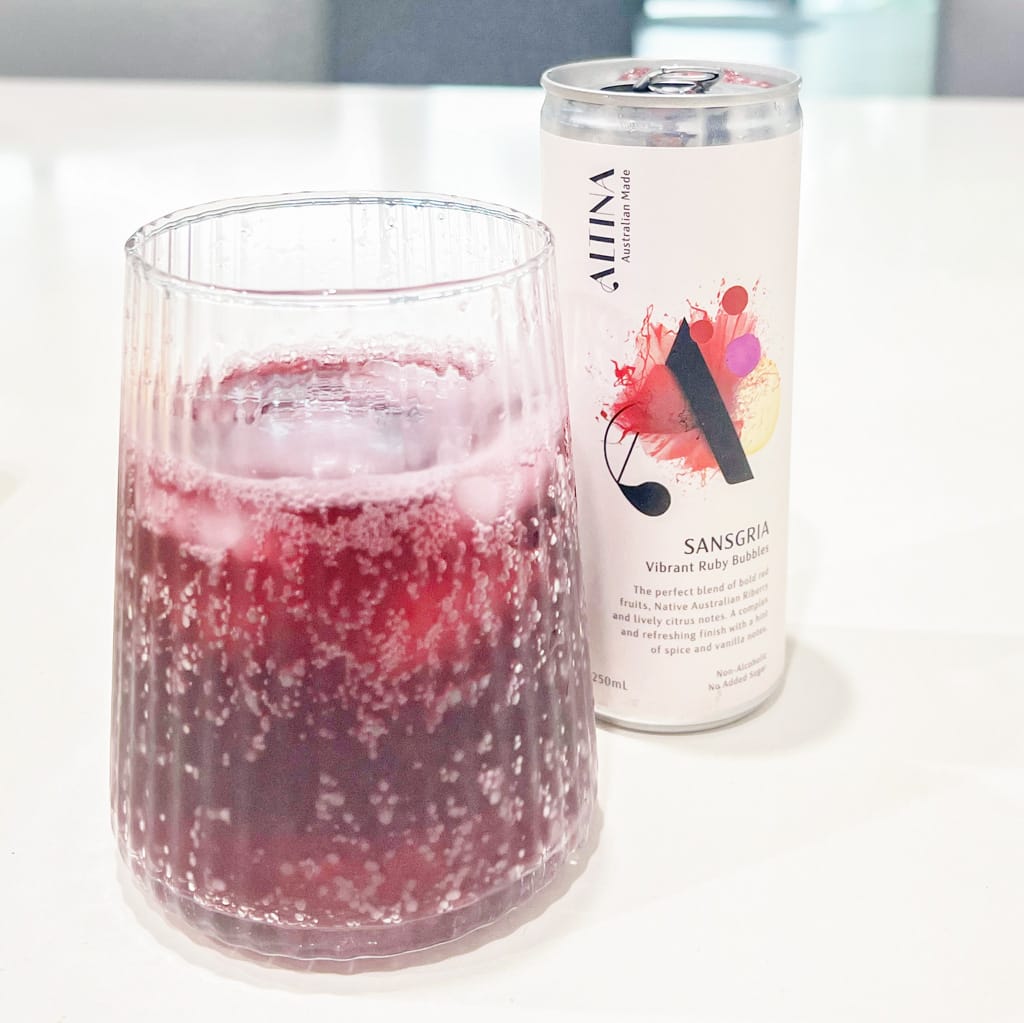 glass of altina shiraz sparkling with can australian non alcoholic drink
